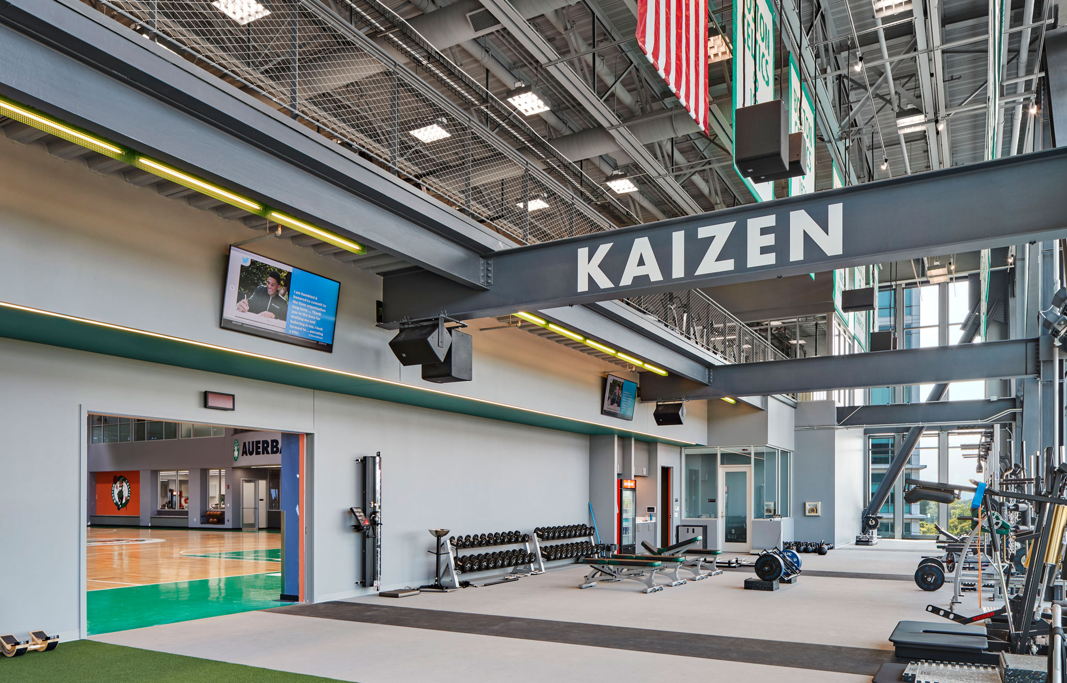 view of weight room looking into courts at Celtics' practice facility