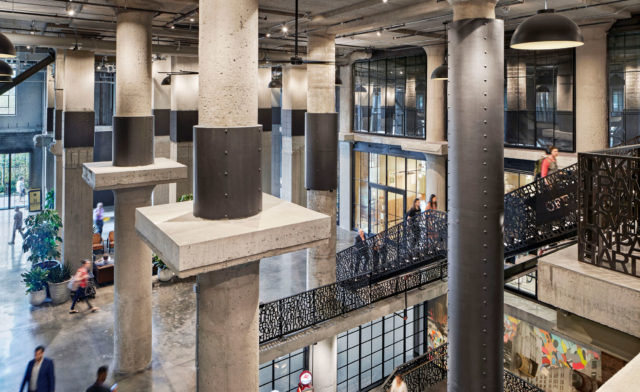 Architects created a grand atrium at 401 Park but cutting away sections of floor plate and revealing the building's industrial character